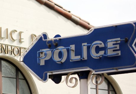 Police-sign-with-building-crop-small